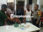 polisi-amankan-dua-pria-dalam-kebun-kelapa-sawit-di-dumai-empat-penjudi-dan-bandar-togel-ditangkap.jpg