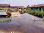 sekolah-diliburkan-karena-banjir-di-rohil.jpg