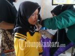 seorang-anak-seang-mengikuti-imunisasi-vaksin-mr_20180909_150820.jpg