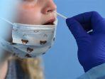 seorang-wanita-di-jerman-menjalani-swab-test-untuk-mendeteksi-virus-covid-19.jpg