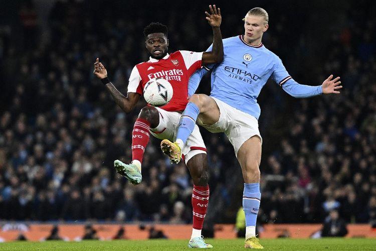 pontianak/Gelandang-Arsenal-Thomas-Partey-berduel-bersama-striker-Manchester-City-Erling-Haaland.jpg