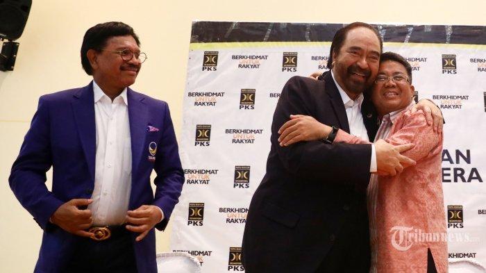 ketua-umum-partai-nasdem-surya-paloh-kiri-berpelukan-dengan-presiden-pks-sohibul-iman.jpg