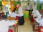 Kepala-Kantor-Kementerian-Agama-Kabupaten-Mempawah-Hasib-23wses.jpg
