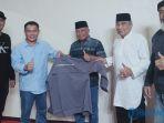 Ketua-Galaherang-Kreasindo-Mas-Yusmidi-baju-biru-didampingi-pengurus.jpg