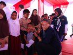 PTPN-IV-PalmCo-saat-membagikan-PMT-kepada-anak-anak.jpg