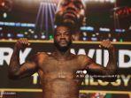 deontay-wilder-tyson-fury-berpose-di-timbangan-mgm-grand-garden-arena.jpg