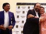 ketua-umum-partai-nasdem-surya-paloh-kiri-berpelukan-dengan-presiden-pks-sohibul-iman.jpg