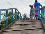 kondisi-jembatan-kayu-di-jl-hidayat-dusun-merpati-sungai-kakap-kubu-raya-xcfrvgrtb.jpg