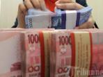 menghitung-uang-rupiah_20150813_091645.jpg