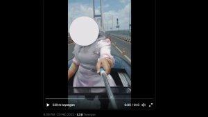 Seorang-ibu-merekam-dirinya-sendiri-bergaya-di-sunroof-ketika-mobilnya-sedang-melaju-di-jembatan.jpg