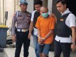 Anggota-Polres-Mojokerto-Kota-menangkap-pria-inisial-JPA-26-tersangka-penganiayaan-anak-tiri.jpg