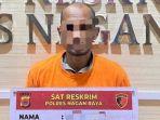 Eks-security-yang-menjadi-tersangka-pembakar-beko-diamankan-di-Mapolres-Nagan-Raya.jpg