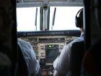 Ilustrasi-pilot-duduk-di-ruangan-kokpit-pesawat.jpg