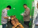 Jenazah-Sastro-22-yang-ditemukan-meninggal-tergantung-di-pohon-belakang-rumah-warga-Keras.jpg