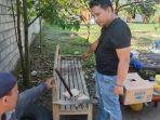 Petugas-mengamankan-barang-bukti-batang-besi-yang-digunakan-pelaku-pembunuhan.jpg