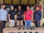 Tersangka-AS-dan-barang-bukti-BB-laptop-diamankan-di-Mapolsek-Langsa-Barat.jpg