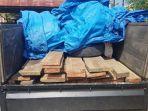 kayu-olahan-diangkut-dengan-pikap-diduga-tak-miliki-dokumen-diamankan-di-mapolres-pidie.jpg