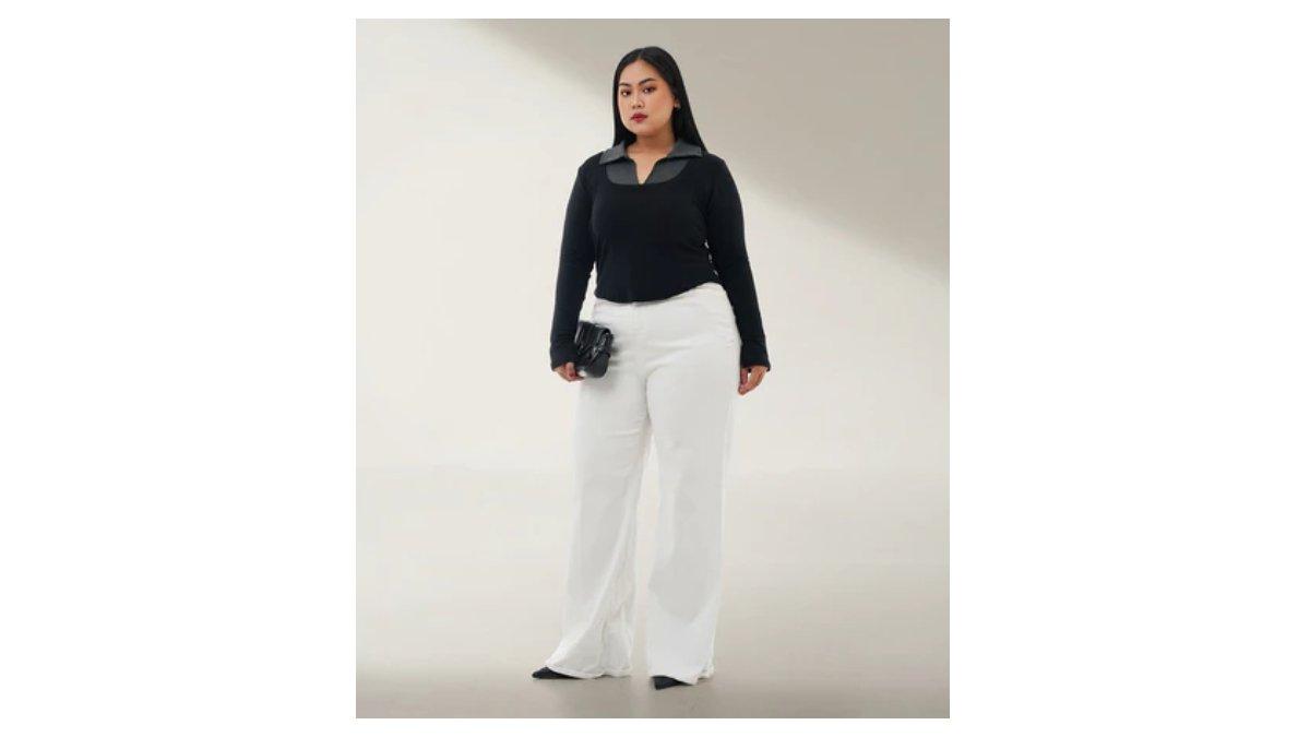 Ilustrasi mengenakan atasan gelap dan memadukannya dengan bawahan yang lebih terang