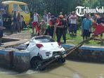 Daihatsu-Ayla-tercebur-ke-dalam-saluran-air-di-wilayah-Desa-Duk.jpg