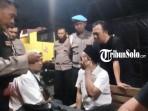 Petugas-kepolisian-mengamankan-2-pelaku-pencopetan-di-Haul-Habib-Ali.jpg