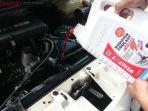 Setelah-air-radiator-lama-dikuras-isi-lagi-menggunakan-radiator-coolant-baru.jpg