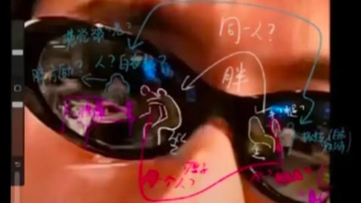 Selfie dari penyanyi Jiao Maiqi memperlihatkan pantulan di kacamata hitamnya menunjukkan dua orang sedang bergulat yang diduga Yu Menglong.