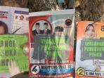 Aksi-warga-memberi-label-tersangka-penusukan-pohon-pada-baliho-caleg.jpg