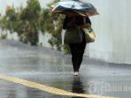 bmkg-cuaca-hujan-ekstrem-payung.jpg