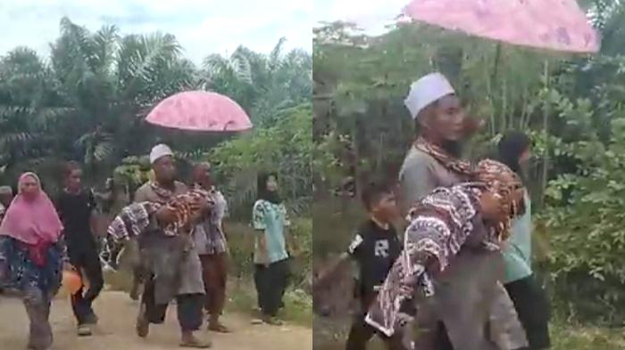 Warga-menggendong-jenazah-balita-korban-tenggelam-di-Desa-Paraili.jpg