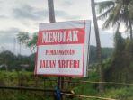 Baliho-penolakan-pembangunan-Jalan-Arteri-di-lahan-milik-Madi.jpg