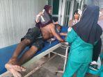 Korban-AR-47-berada-di-Puskesmas-mendapat-perawatan-setelah-tangannya-parang.jpg