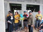 Proses-penyerahan-hewan-kurban-ke-masyarakat-di-kompleks-Masjid-Nurul-Falah-Muhammadiyah.jpg