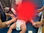 dlan-3-bulan-saat-mendapatkan-perawatan-medis-di-Puskesmas-Tapalang.jpg