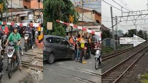 detik-detik-petugas-dan-warga-saling-bantu-untuk-membantu-pengendara-sebrangi-rel-kereta.jpg