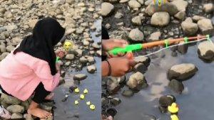 viral-cara-kocak-seorang-wanita-temani-pacar-memancing-bawa-mainan-bebek-demi-hibur-diri.jpg