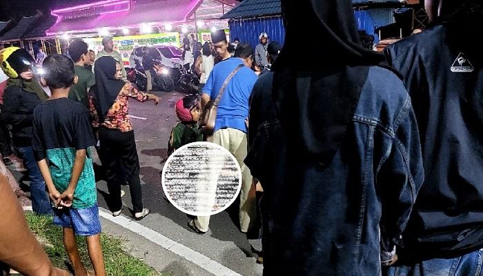 Puluhan-warga-memadati-lokasi-kecelakaan-dua-pemuda-di-samping-Taman-Meohai.jpg