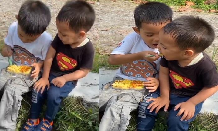video-viral-romantisnya-anak-lelaki-ini-telaten-suapi-adiknya-makan-nasi-kuning.jpg