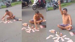 Viral-Pria-di-Tapanuli-Tengah-Tumpuk-Uang-Ratusan-Juta-di-Tengah-Jalan-Tantang-Warga-Adu-Kekayaan.jpg