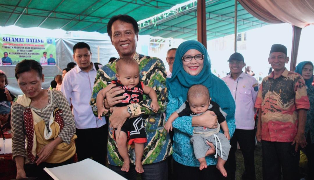 Penjabat-Bupati-Ogan-Komering-Ilir-Asmar-Wijaya-dan-Ketua-TP-PKK-OKI-Sukmawati.jpg