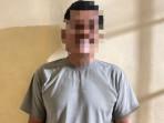 Ahmad-Kholis-49-seorang-pria-di-Kabupaten-Kampar-Riau-dengan-teg.jpg