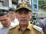 Pj-Wali-Kota-Palembang-Ratu-Dewa-saat-datang-ke-lokasi-lakalantas-di-Jalan-MP-Mangkunegara.jpg