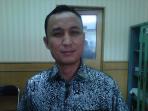 anggota-dprd-sumsel-rizal-kennedi-tertawa_20151109_231634.jpg