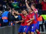 pemain-cska-moskva-melakukan-selebrasi-setelah-nikola-vlasic-mencetak-gol-ke-gawang-real-madrid_20181003_042643.jpg