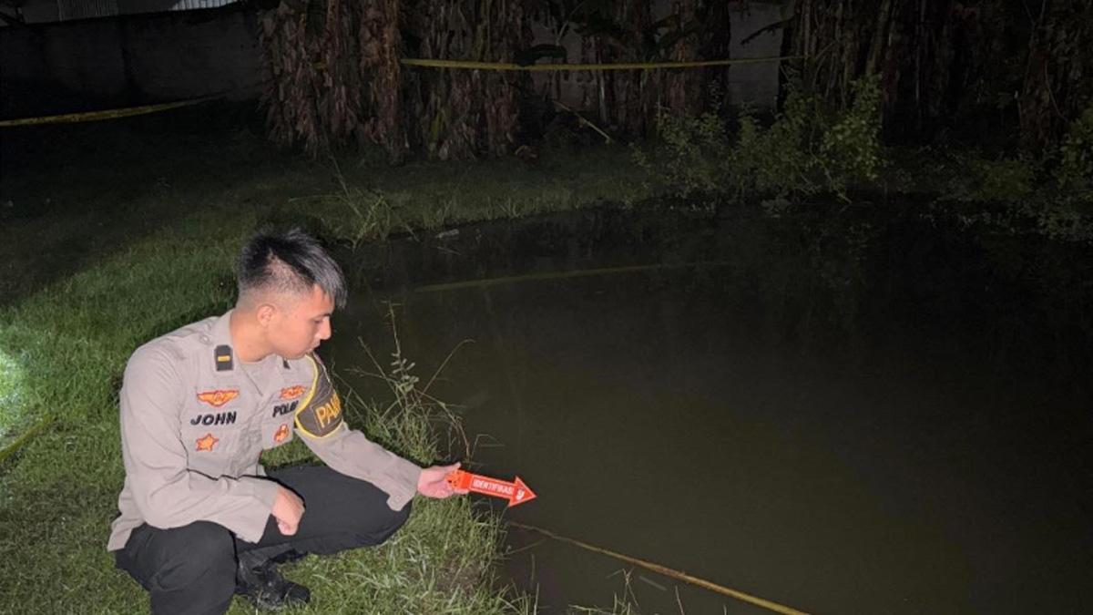 OLAH-TKP-Polisi-saat-melakukan-olah-TKP-di-kubangan-air-yang-rencananya-untuk-kolam-ikan.jpg