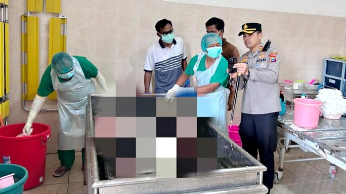 Petugas-Satreskrim-Polres-Pacitan-saat-melakukan-identifikasi-jasad-Wawan.jpg
