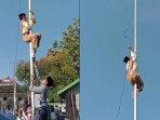 Aksi-Sakha-Ardiansyah-memanjat-tiang-bendera-saat.jpg