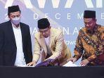 penandatanganan-MoU-MUI-Jatim-dan-Harian-Surya.jpg