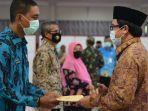 plt-bupati-jember-drs-kh-a-muqit-arief-saat-prosesi-pengembalian-jabatan-tiga-pejabat.jpg
