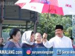 gus-ipul-memayungi-puti-guntur-dan-megawati_20180429_233805.jpg