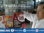 petugas-kpu-kabupaten-malang-memperlihatkan-pamflet-dan-poster-sosialisasi-pilgub-jatim_20180405_183437.jpg